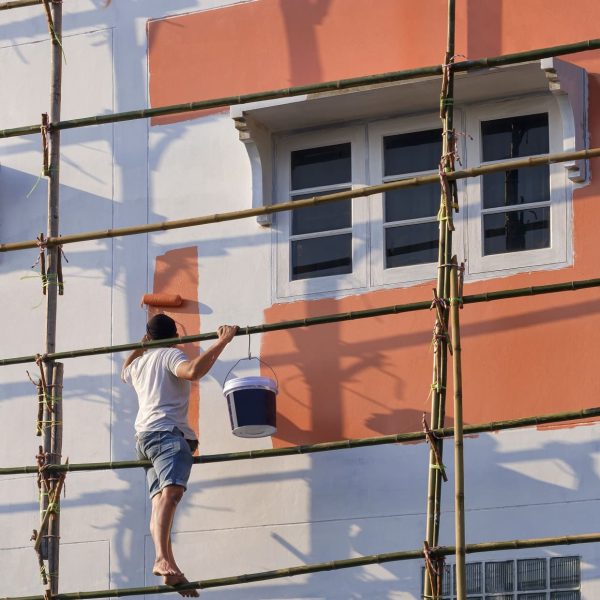 asian-builder-worker-on-wooden-scaffolding-is-pain-2023-11-27-04-50-16-utc