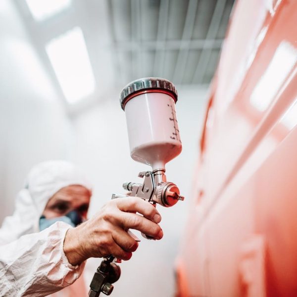 close-up-of-paint-spray-gun-worker-painting-a-car-2023-11-27-05-31-35-utc