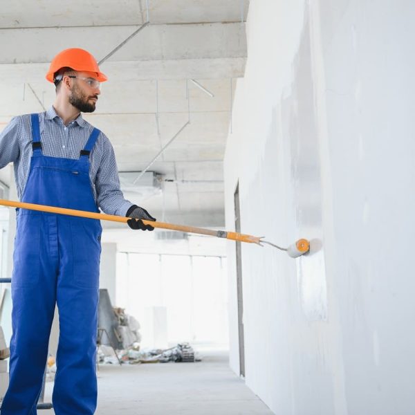 painter-man-painting-the-wall-with-paint-roller-2023-11-27-04-49-40-utc